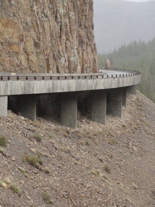 A roadway trestle on the side of a cliff