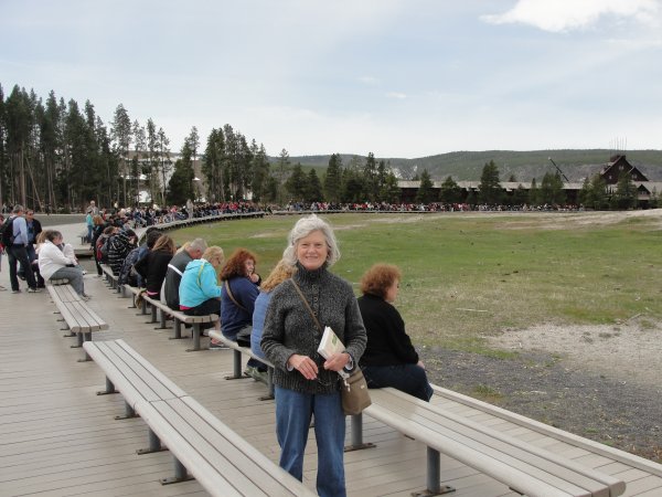 Sandra waiting on Old Faithful
